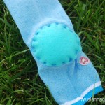 If you want the nose area to be round cut a circle of felt and sew it over the heel full of stuffing. If you want the nose area to be oblong pinch the top of the heel to the bottom of the heel and sew together.