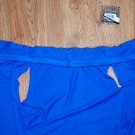 Open up your t-shirt. Pin the sleeve you sewed together along the top edge of the t-shirt. Pin the right side of the sleeve strip to the inside of the t-shirt. Pin along the top edge.