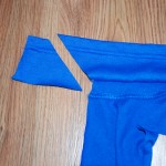 Sew along the top edge where you pinned. Lay the collar open flat. Trim off any extra length by cutting it at an angle.