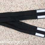 Create Jake's belt using a black strip of fabric. Measure your child's waist for how long it needs to be. Make sure to leave enough length for the Velcro to overlap. Fold over and sew the entire outside edge of the belt fabric. Cut Velcro strips and sew ends of belt.