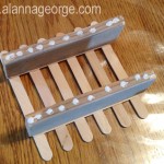 Cut the wood you will use for your spacer to be same length as a craft stick. They can be about 1" - 1.5" wide. Glue the a wooden rectangle to the each horizontal craft stick on one fence side. Next glue on the 2nd fence side. Let dry.