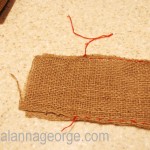 Continue stitching down the first long side. Then stitch across the center of the bottom and the up the other long side. Knot thread and trim.