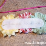 Place a line of hot glue on the back of the felt and glue on the elastic band.